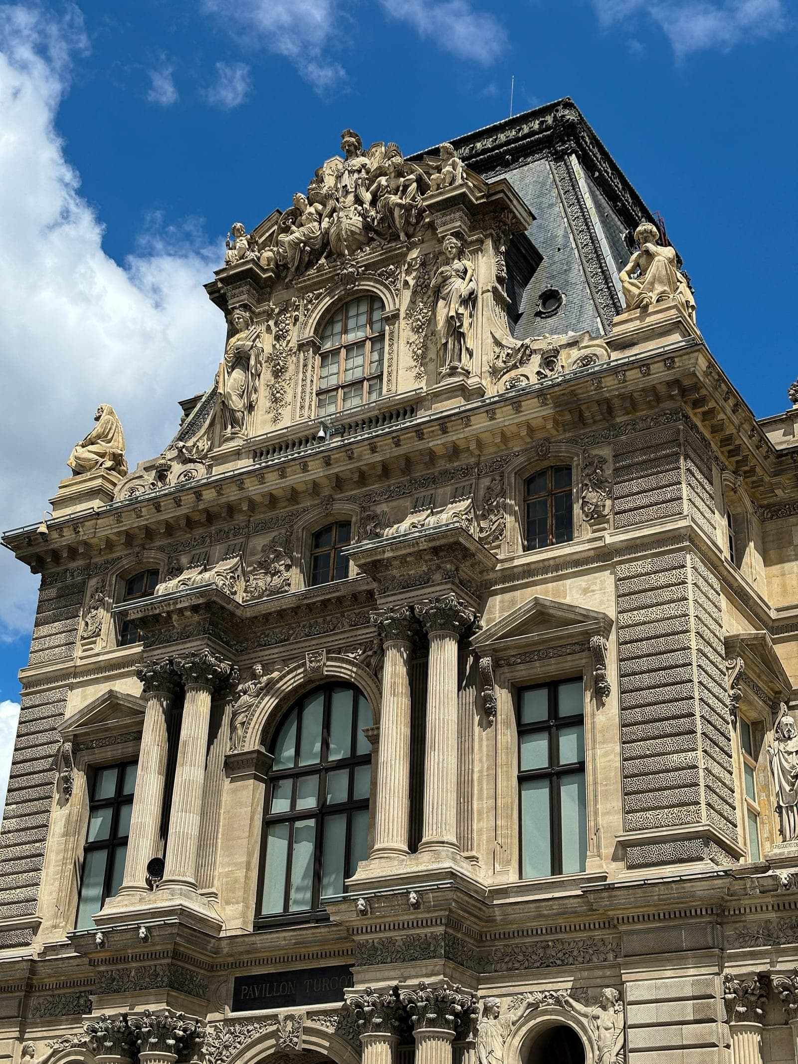 Ornate neoclassical facade of the Louvre, Paris